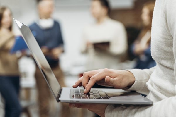 man-working-laptop-while-standing